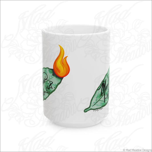 White ceramic mug with glossy white finish and comfortable c-handle featuring hand-drawn flaming leaf art and black text