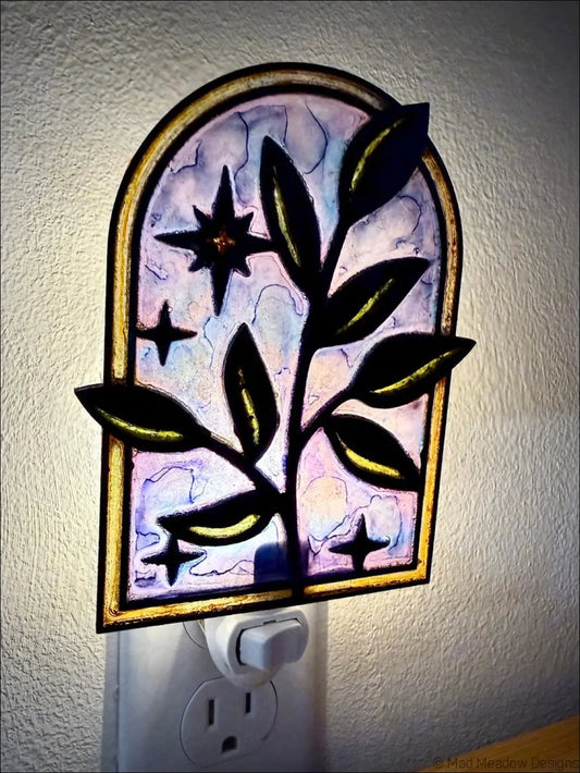 Arched stained-glass night light with elegant branch and twinkling stars design in purple blue gradient and dark metal frame