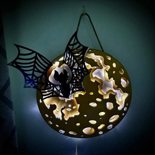 Glowing golden moon and bat hanging wall light led usb with textured gold surface and enchanting laser-cut wood design