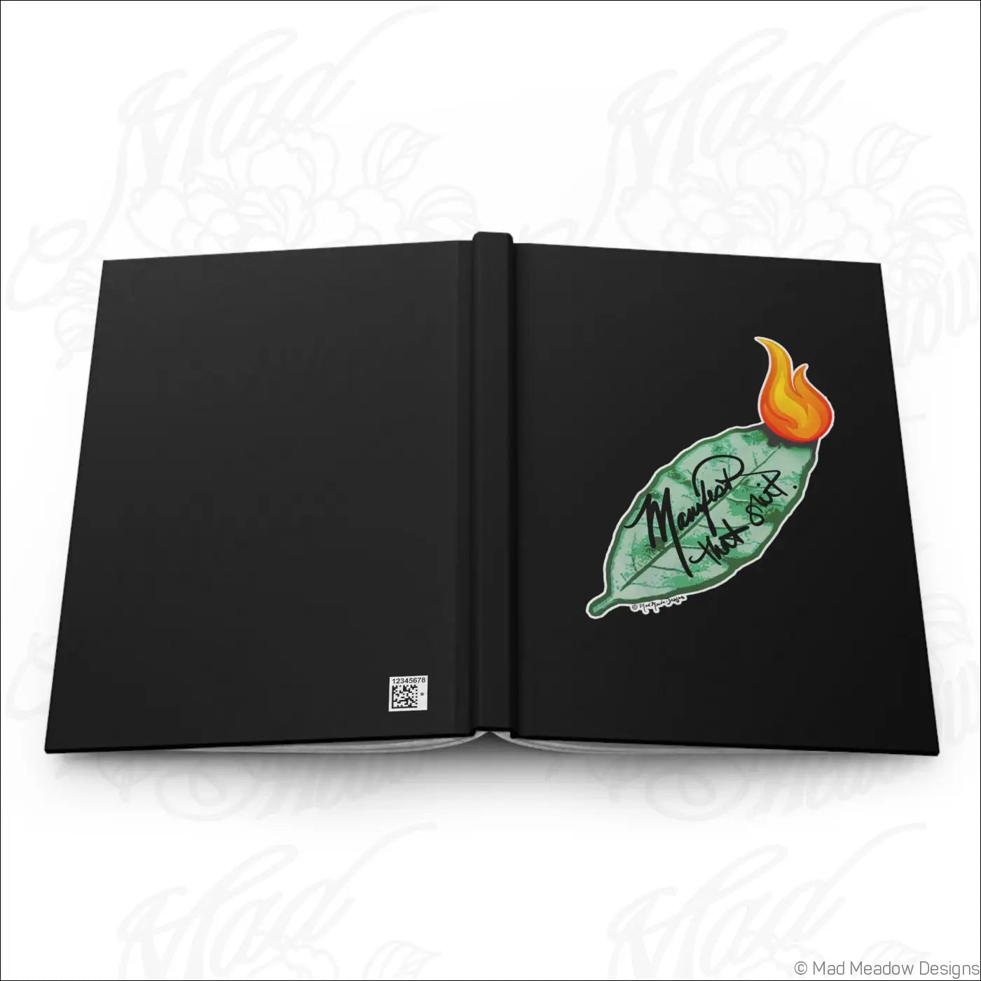 Black hardcover journal with matte laminated cover and bay leaf sticker next to mashal hot out text on right page