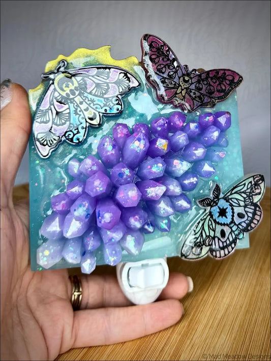 Mesmerizing crystal cluster moths and crystal cluster wall night light with soft aqua blue resin base and delicate iridescent moths