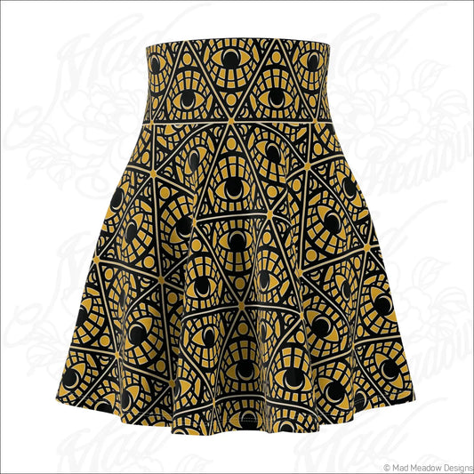 Mustard skater skirt with bold gold and black mystic eye tribal pattern on stretch fabric with printed care label