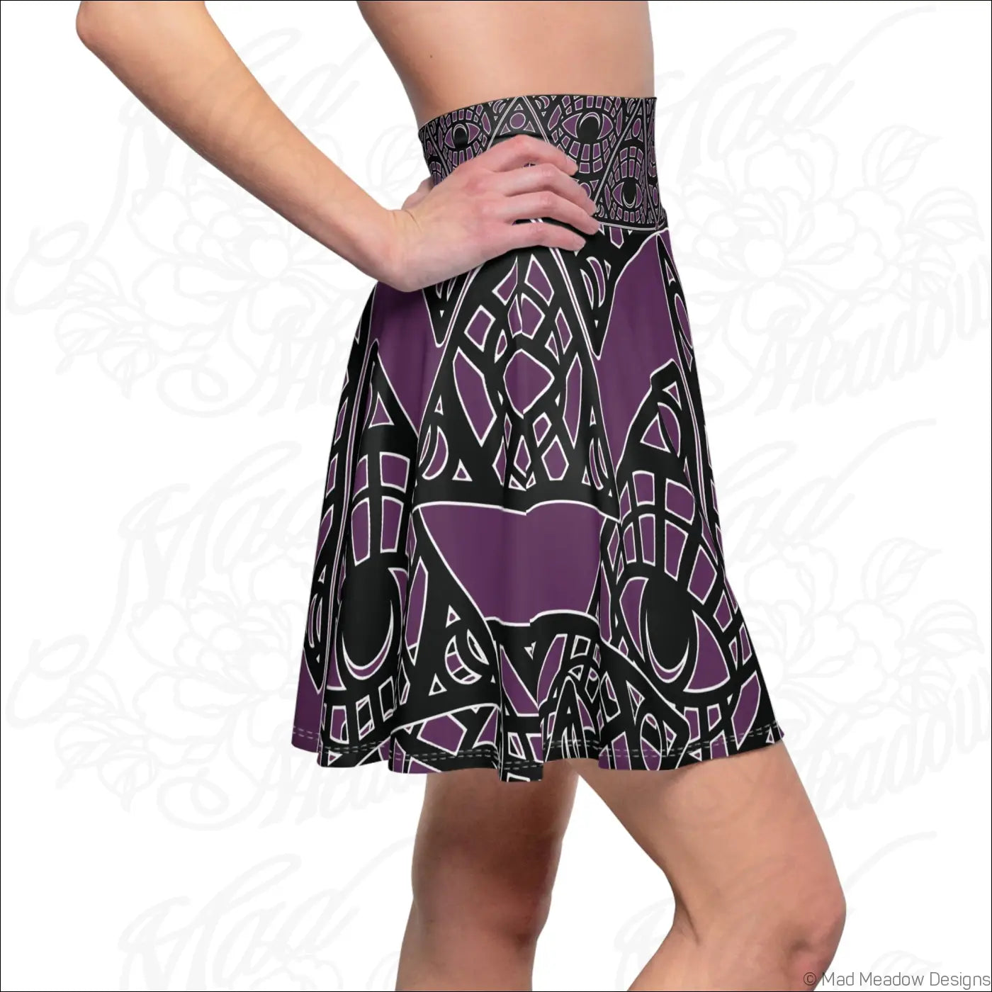 Purple and black geometric printed skater skirt with stretch fabric and high waisted design featuring printed care label