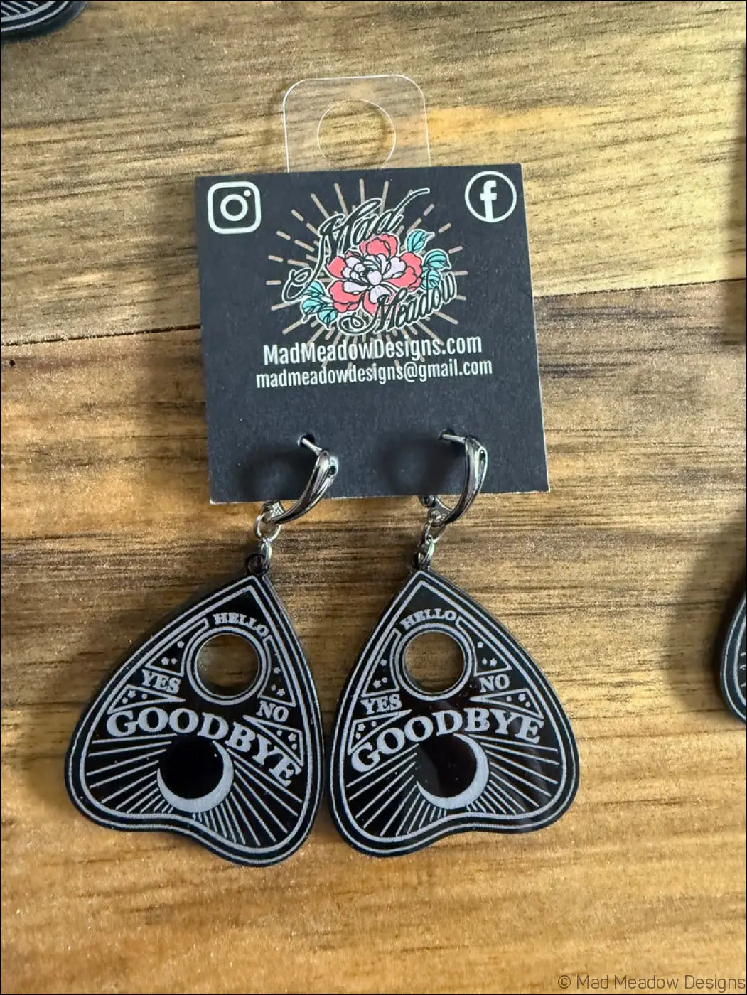 Black ouija planchette plexiglass earrings with white hello yes no goodbye text and moon design with silver hooks