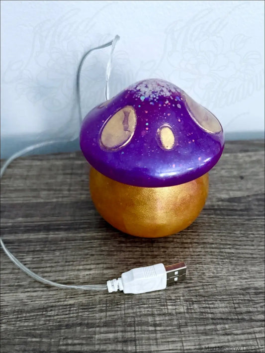 Purple and gold chubby mushroom usb light with a glittery cap and glossy finish designed as a usb-powered led lamp