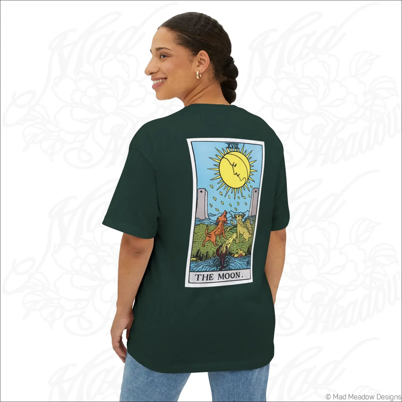 Dark green oversized boxy t-shirt with colorful rider waite smith the moon tarot card graphic featuring sun and dogs