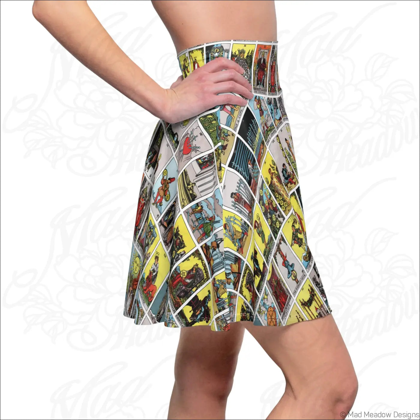 A flared skater skirt with vibrant tarot card print in yellow red and blue, easy care instructions recommend line dry