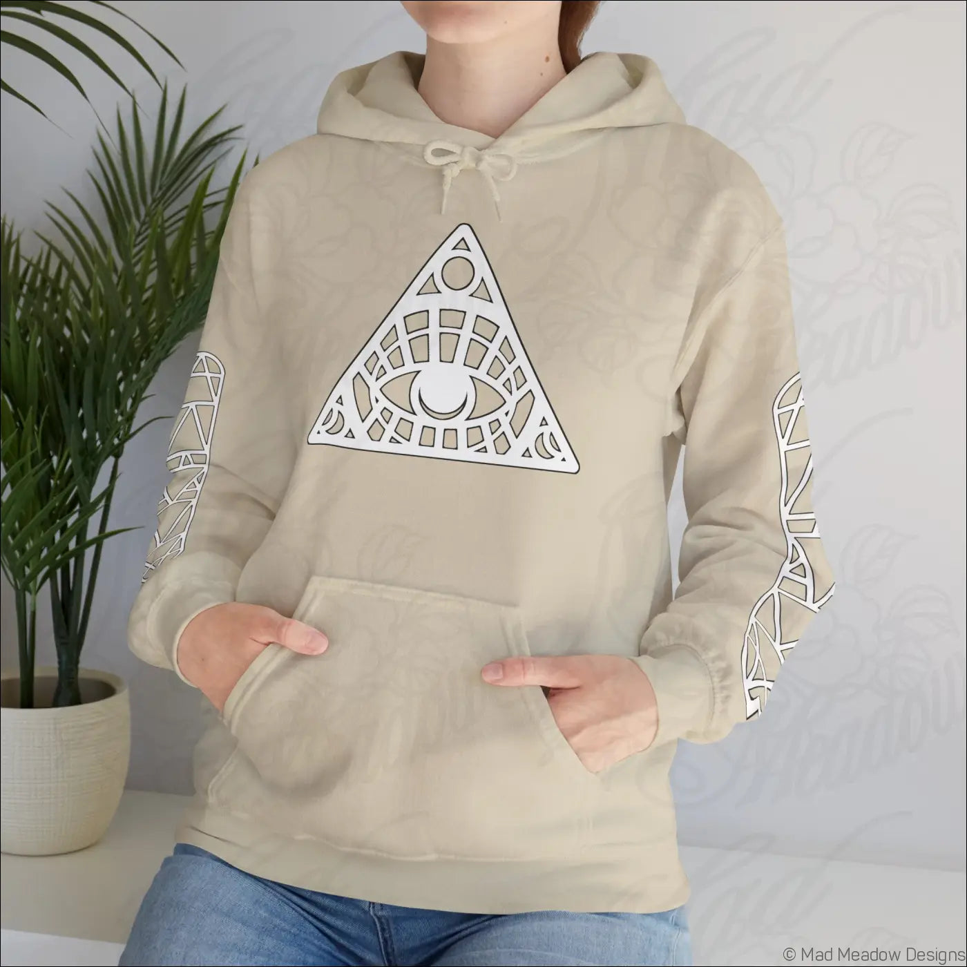 Beige all seeing eye triangle hoodie with white geometric eye design and kangaroo pouch care instructions tumble dry safe
