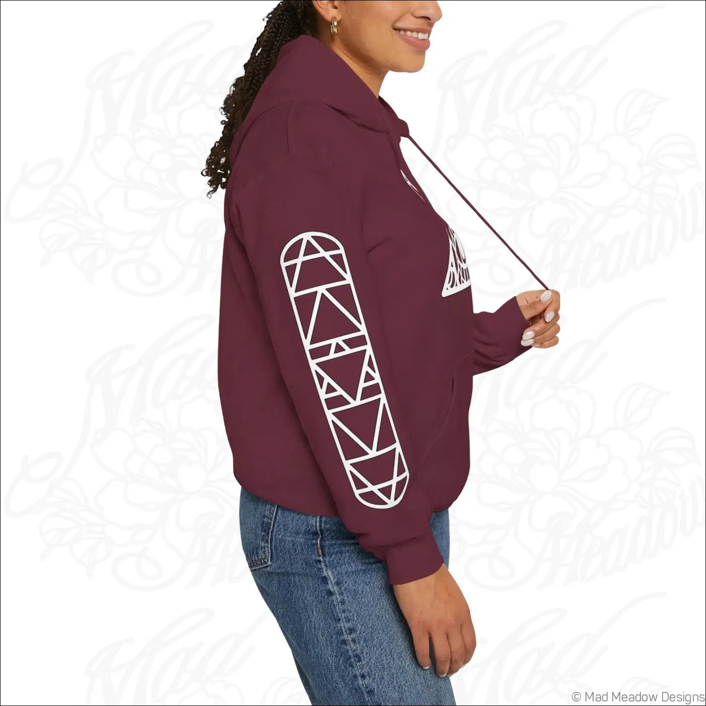 Dark brown all seeing eye triangle hoodie with white geometric sleeve patterns and kangaroo pouch care instructions tumble dry