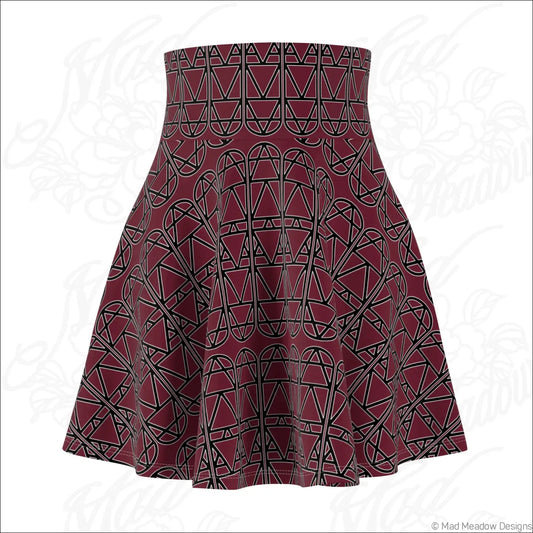 A maroon high waisted skater skirt with bold black geometric column repeat pattern and care instructions line dry