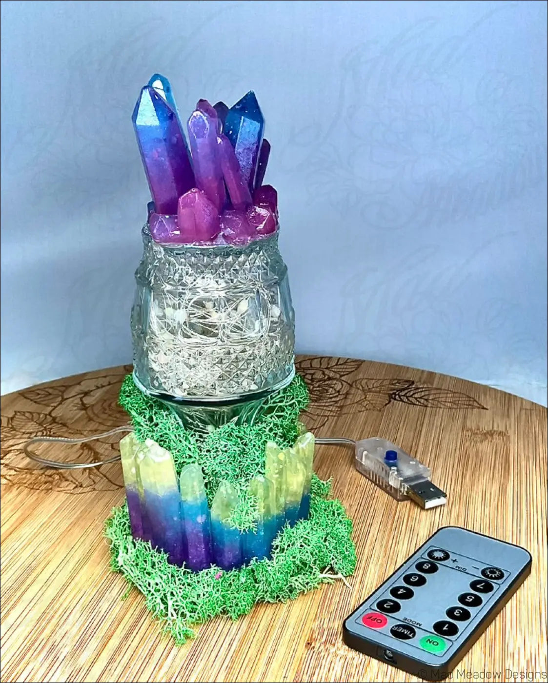 Captivating crystal and moss usb light with vibrant blue and purple quartz crystals on clear glass jar base