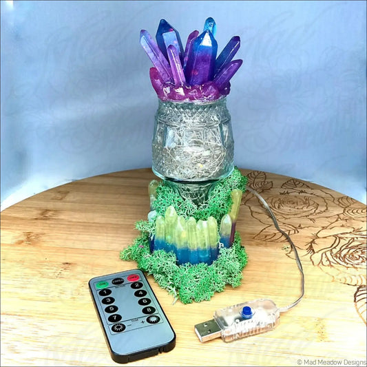 Captivating crystal and moss usb light with iridescent purple blue crystal cluster and clear glass base in green moss