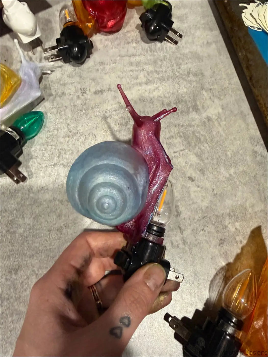 Charming snail night translucent blue and maroon nightlight with spiral shell and clear bulb for whimsical wonderland vibes