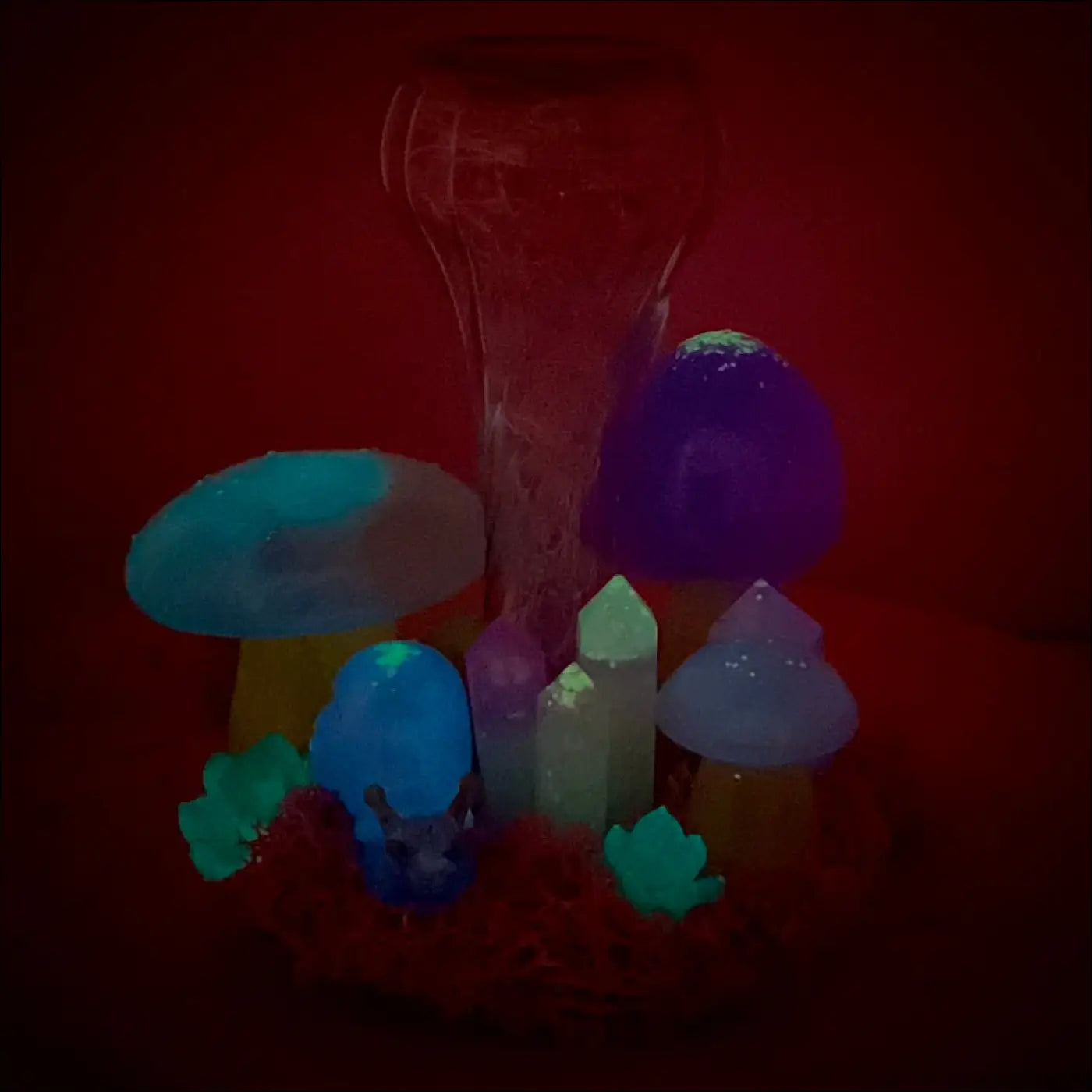 Colorful tabletop light with handcrafted resin mushrooms snail companion and crystals glowing in blue purple and green hues
