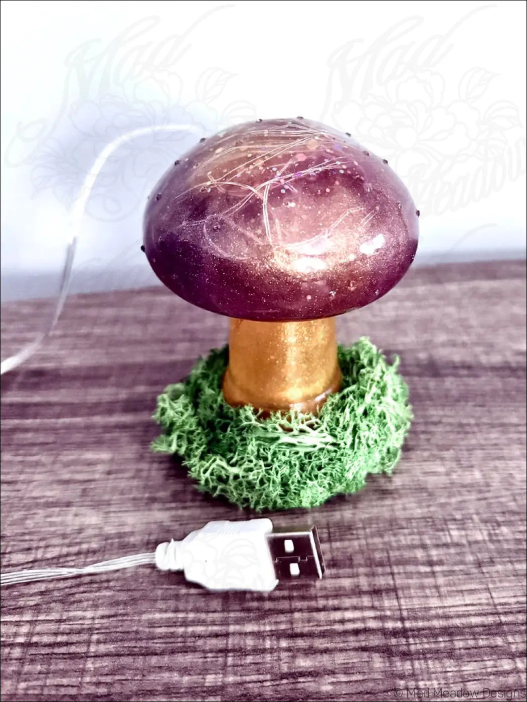 Cute mushroom usb light with purple and gold glittery resin cap and moss base for cozy desk lighting