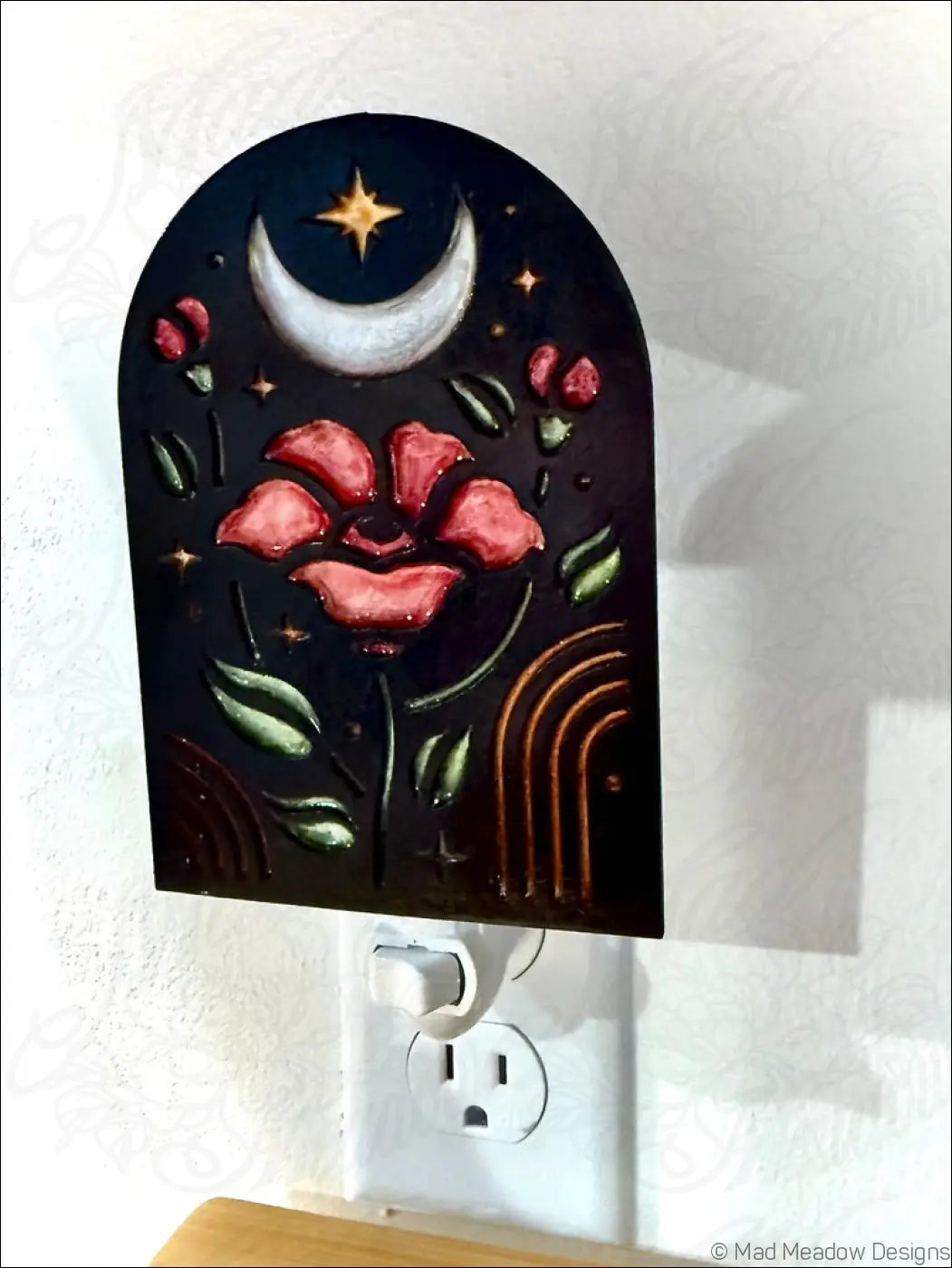 Dark arched night light with elegant red poppy flowers moon and star design on black background for cozy decor