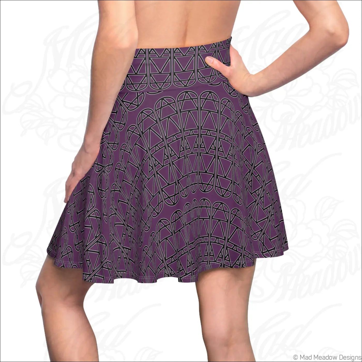 A flared purple skater skirt with bold black geometric pattern care instructions recommend hand wash only