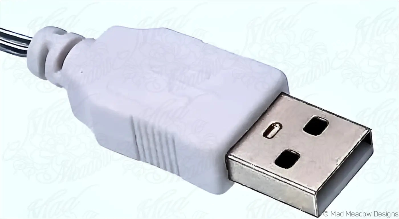 White plastic usb-a connector with metallic contact plate on the back of a hand-inked 3d printed mystical sanctuary night light