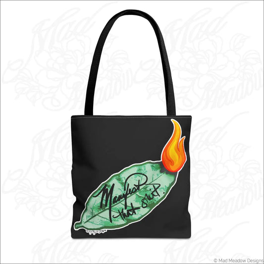 Black eco tote bag with boxed corners featuring a green bay leaf and orange flame with manifest that shit script