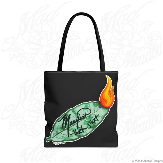 Black eco tote bag with boxed corners featuring a vibrant bay leaf and orange flame with manifest that shit script
