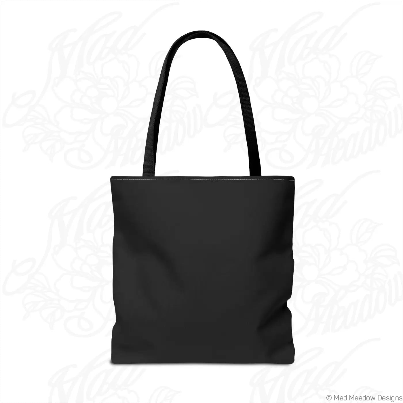 Black canvas flaming bay leaf tote bag with sturdy handles and boxed corners featuring care instructions