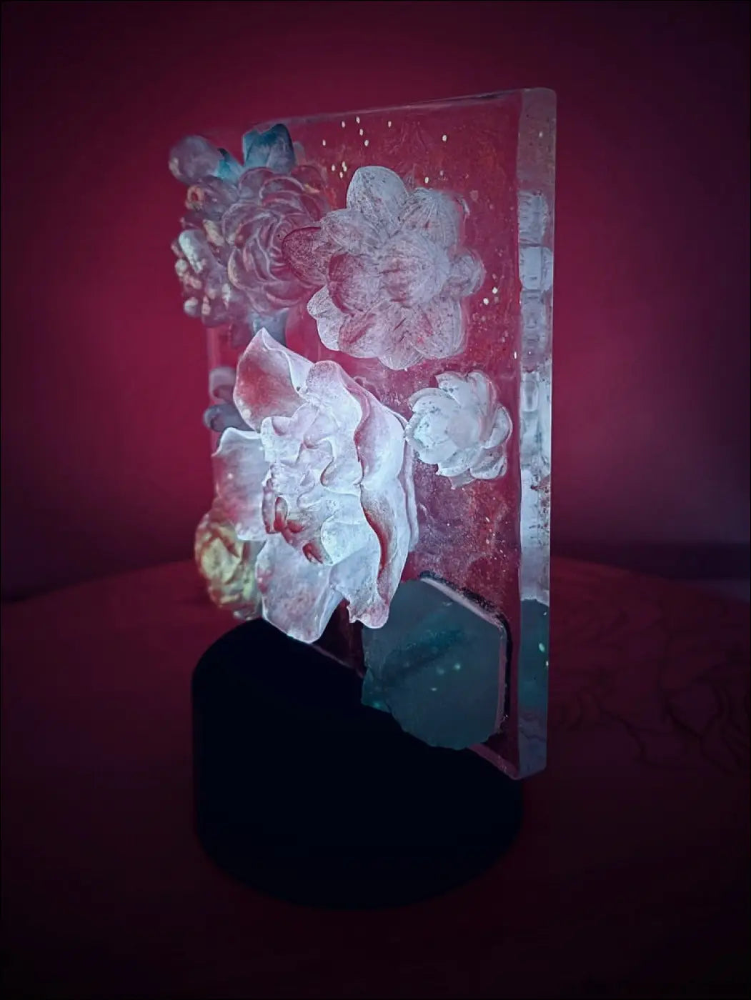 A translucent rectangular resin pastel garden nightlight with intricate floral designs in dreamy hues and rgb color change