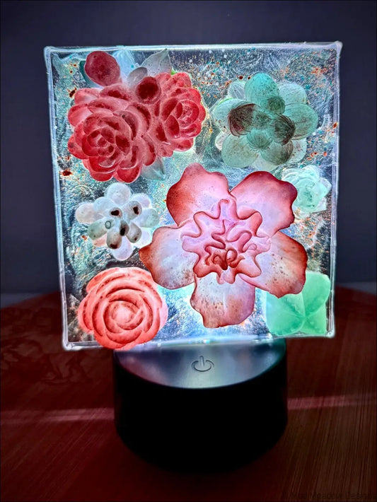 A square glass pastel garden nightlight with colorful floral designs and dreamy hues for enchanting decor