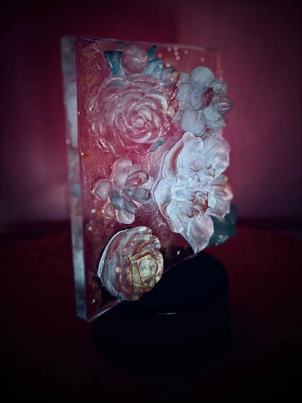 A translucent resin pastel garden nightlight with embossed roses in soft pink white and blue dreamy hues rgb color change
