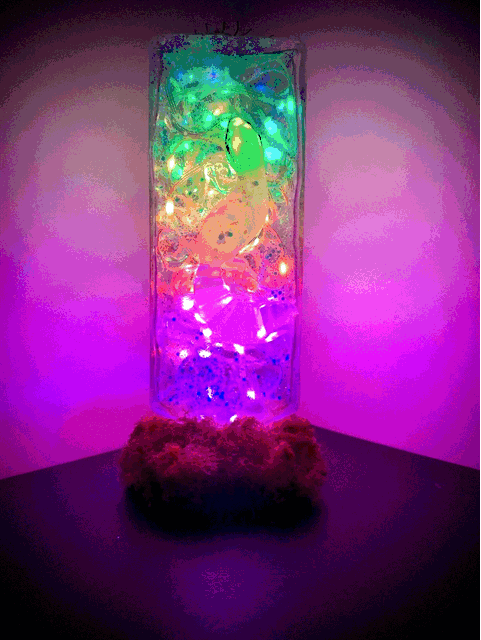 Glowing rectangular glass usb lamp filled with colorful liquid moss and crystals from gecko and lotus on glass bottle