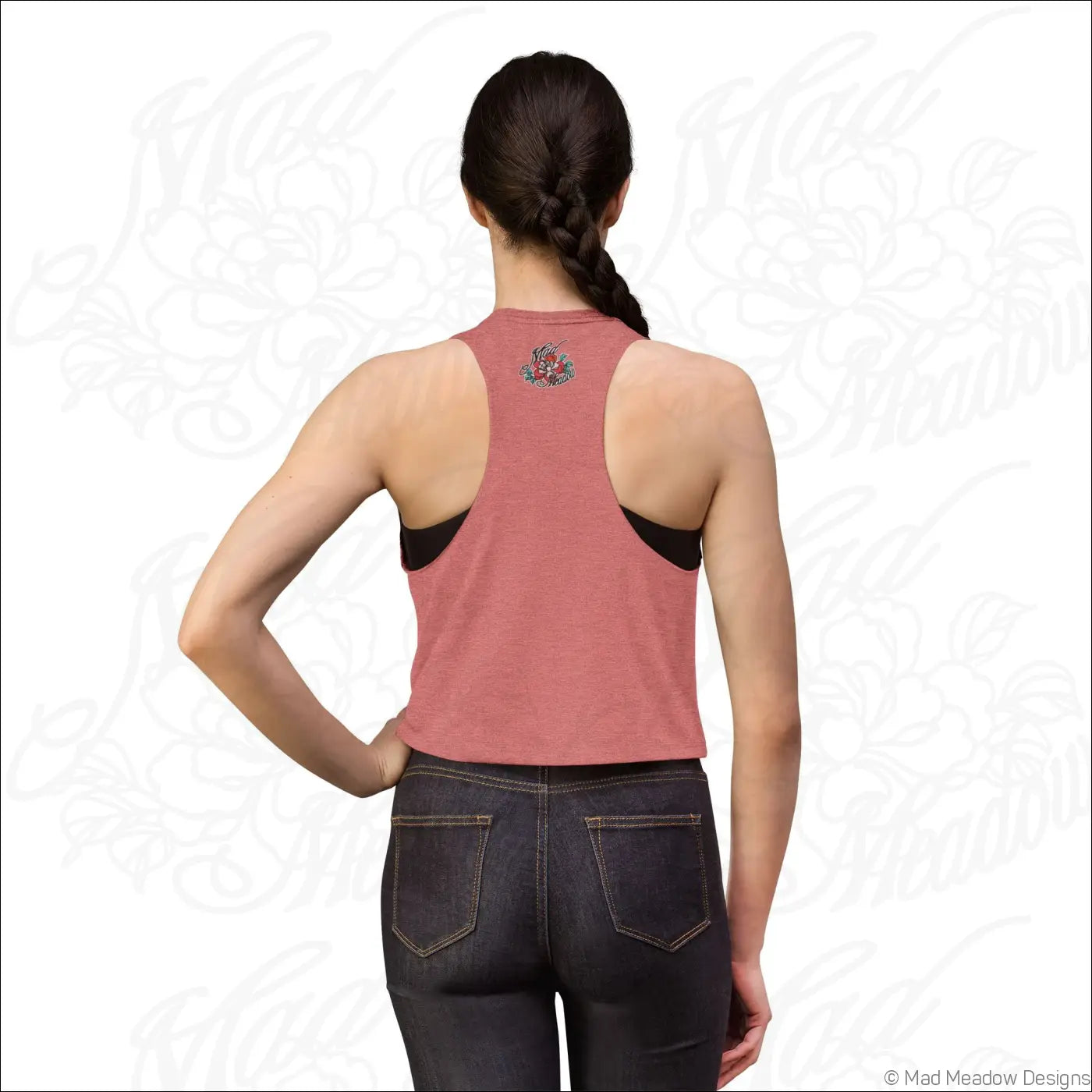 Back view of a dusty rose geometric arch pattern crop top with black mesh panels raw sleeve edges and floral embroidery