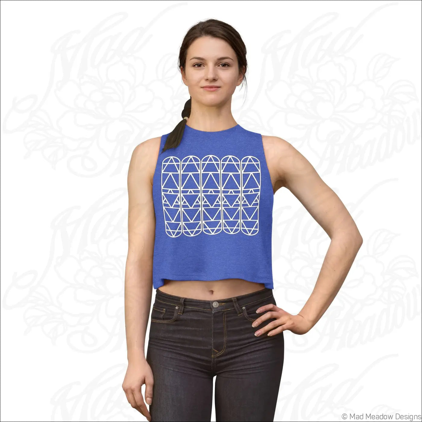 Blue sleeveless crop top with white geometric triangle pattern and raw sleeve edges perfect for summer wear