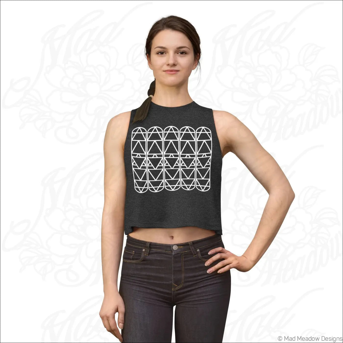 Dark gray sleeveless crop top with white geometric triangle pattern and raw sleeve edges for summer wear