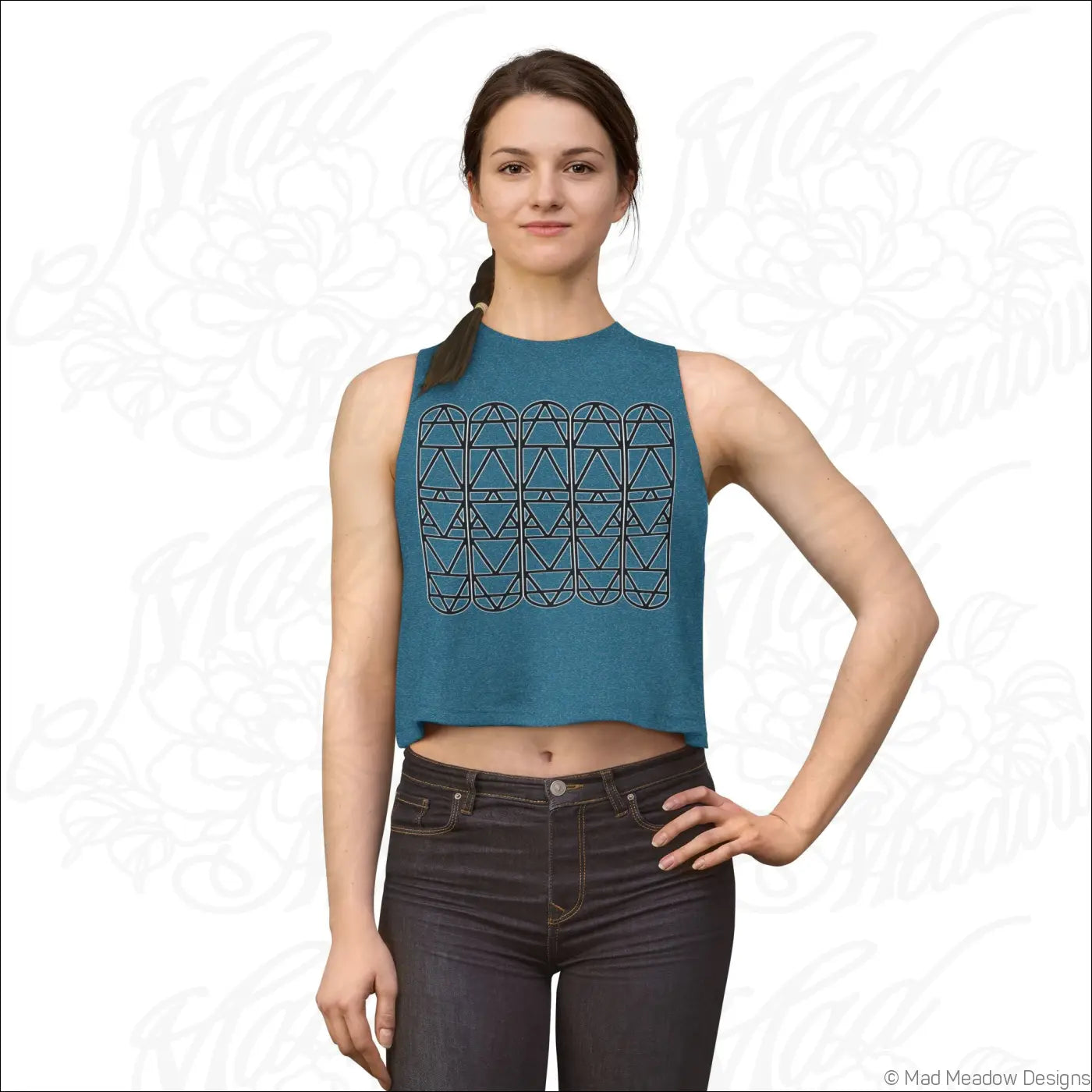 A teal sleeveless crop top with a black geometric triangle pattern made from combed ring spun cotton