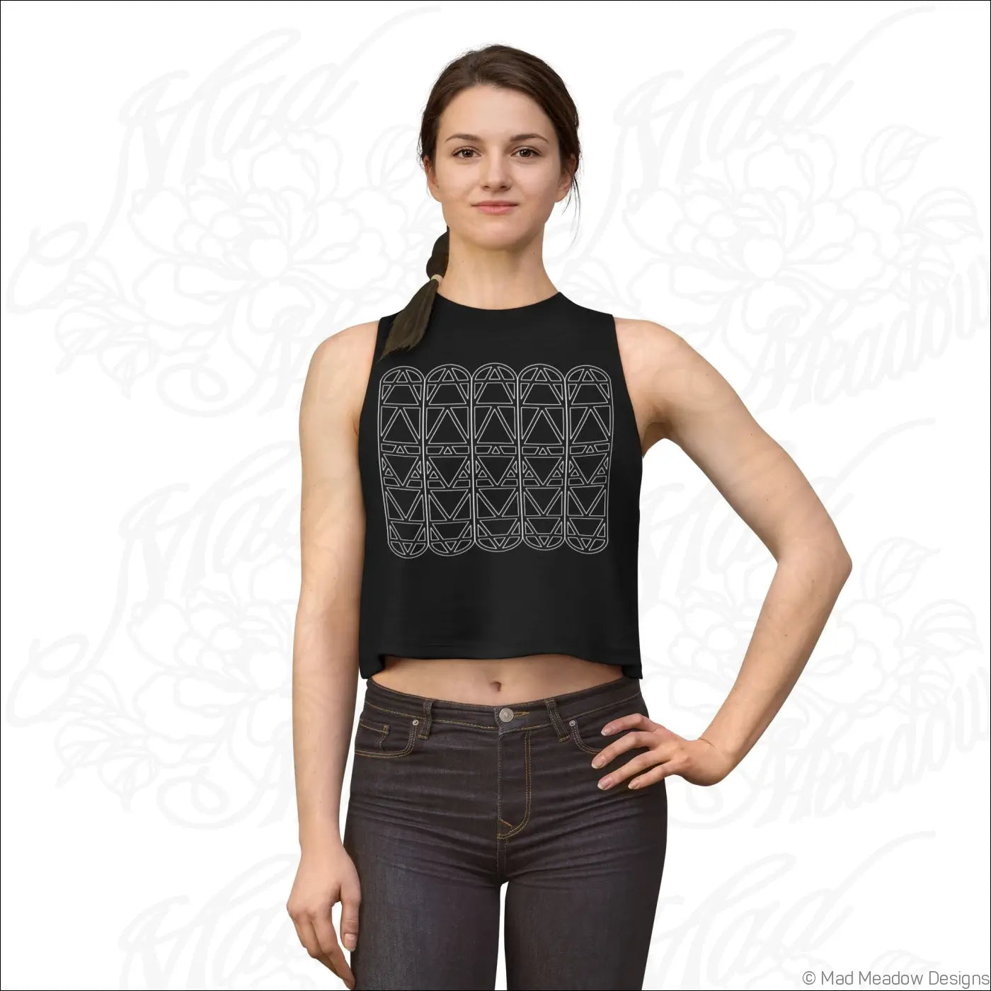 Black sleeveless crop top with white geometric triangle pattern made from soft combed ring-spun cotton fabric