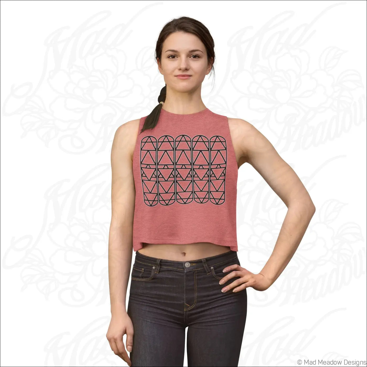 Pink sleeveless crop top with black geometric triangle pattern made from soft combed ring spun cotton