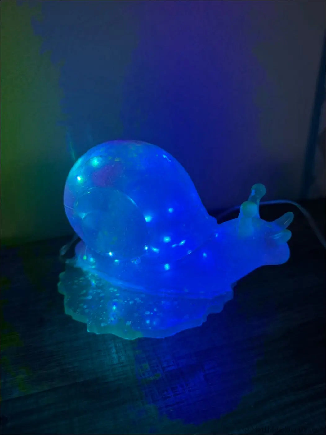 A translucent blue snail-shaped led nightlight with glowing lights for giant purple snail light rgb usb or battery use