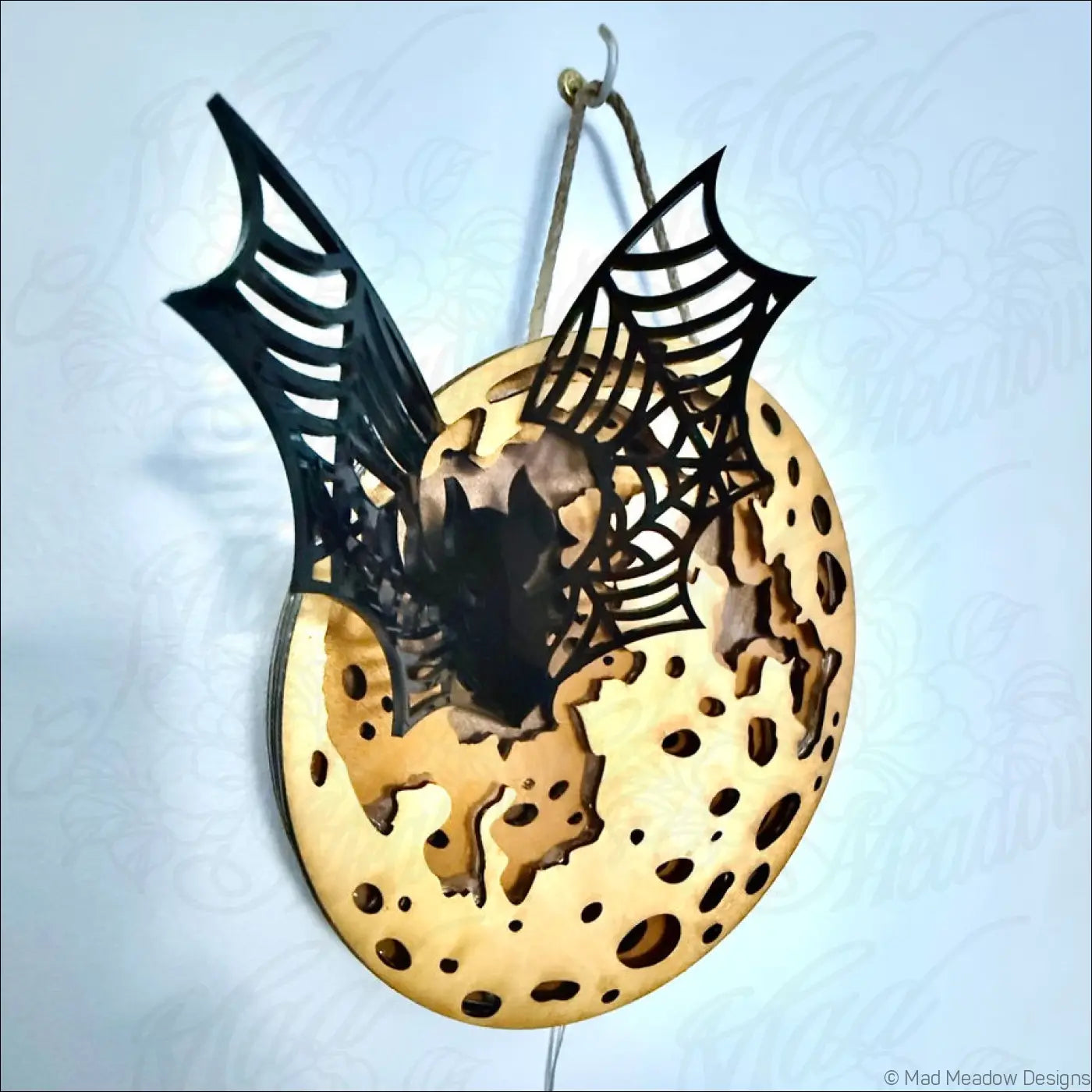Glowing golden moon and bat hanging wall light with black bat spiderweb cutout on enchanting laser-cut wood plaque