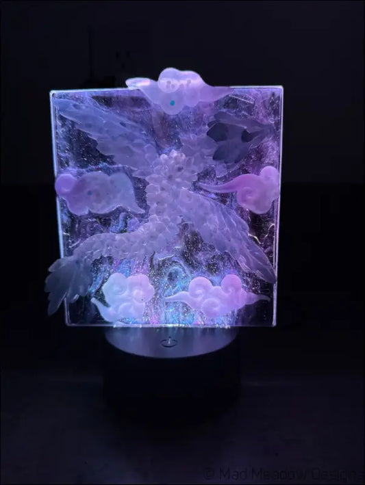 Glowing Resin Phoenix Sculpture with Night Sky and Purple Dragon Lighting - Light