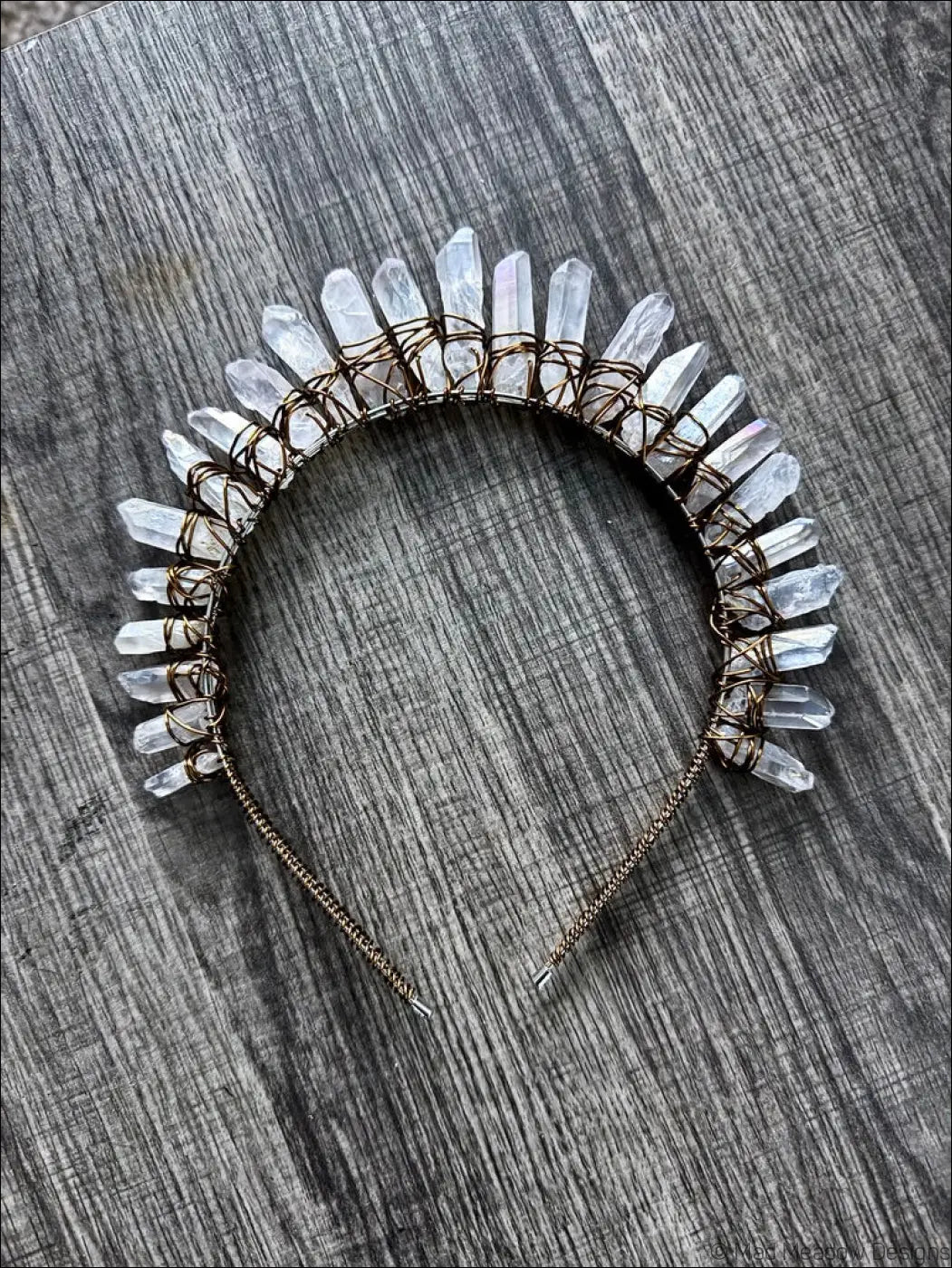A delicate translucent quartz crystal headband crown with dark golden wire frame and chain adjuster for a golden goddess look