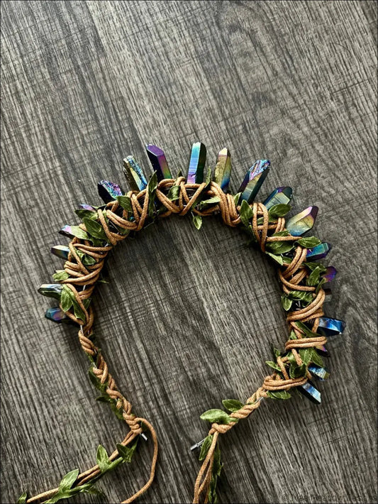 A dark golden goddess handcrafted crystal and leaf headband crown with iridescent quartz and woven green leaves