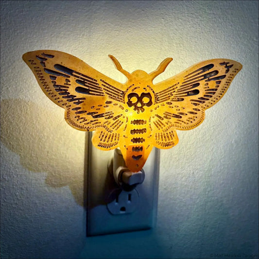 Golden death moth resin wall night light with skull design and intricate cut-outs perfect as a feather wall night light
