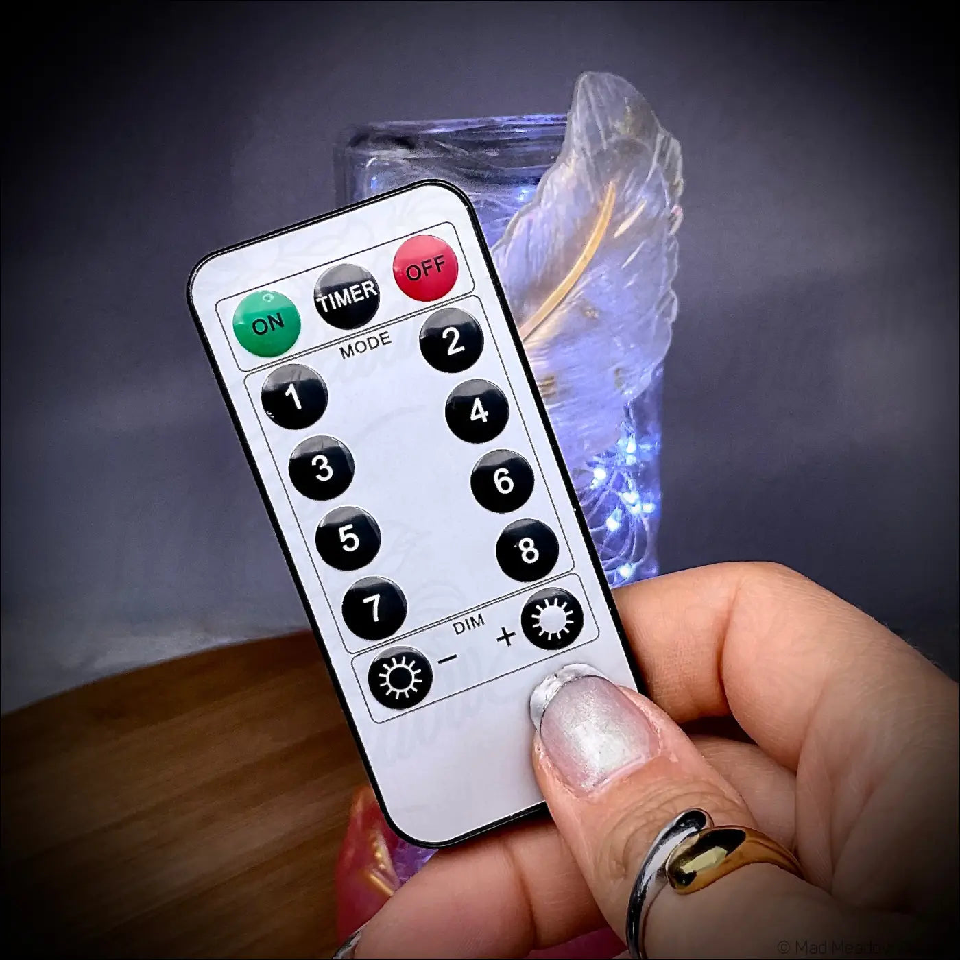 Silver remote control with black buttons for golden feather antique glass apothecary bottle usb light
