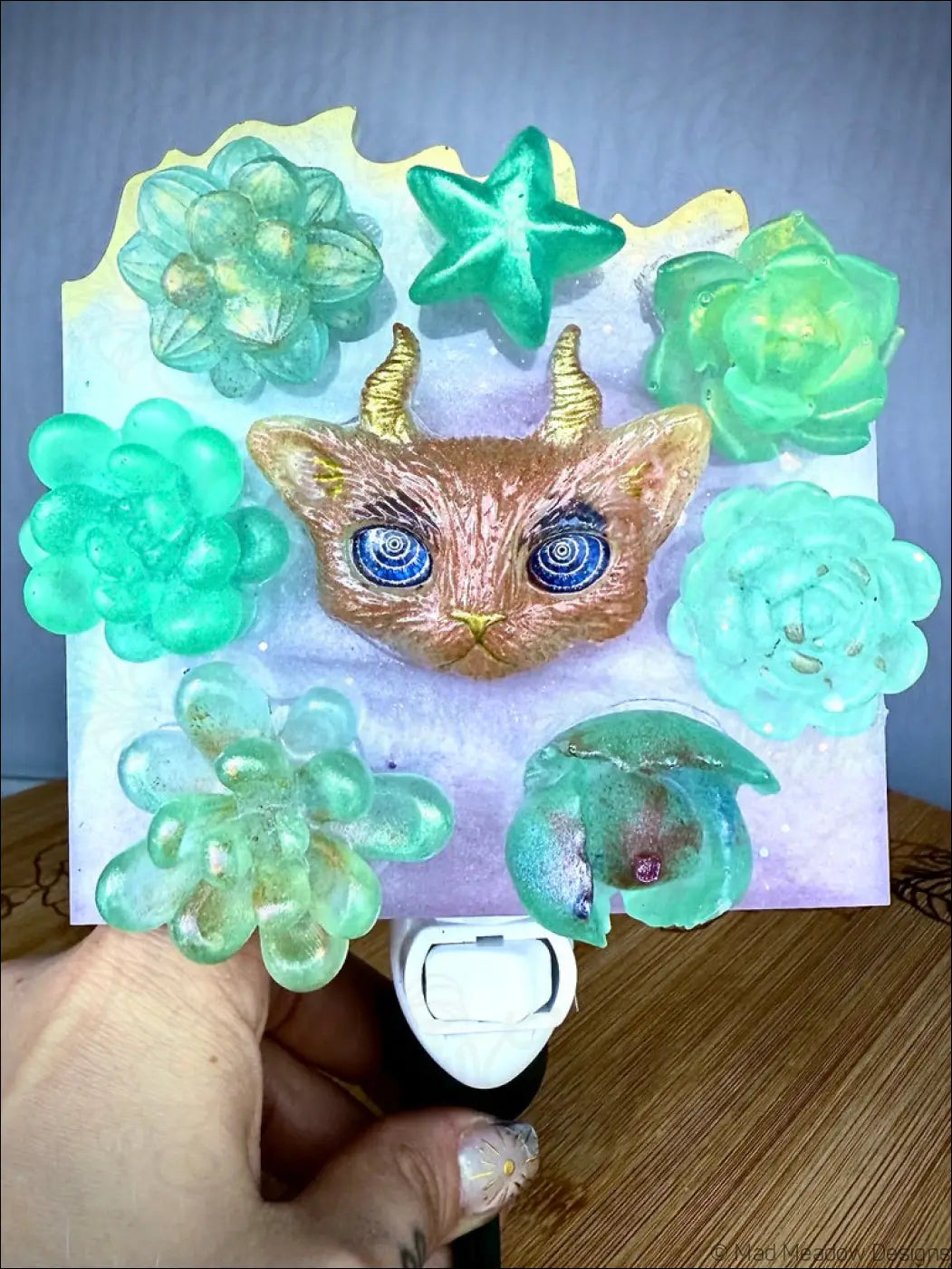 Whimsical horned kitty cat garden wall night light with golden horn blue eyes and green succulent resin decor on plug-in base