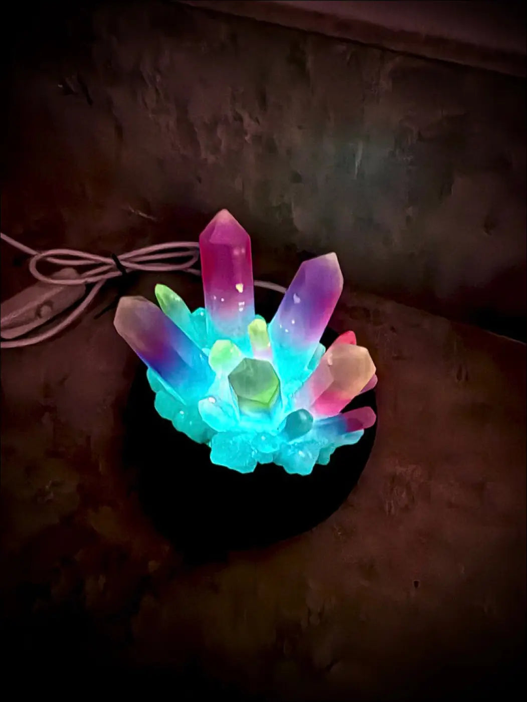 Large resin crystal cluster glow in the dark lamp with pink purple green resin crystal facets on black wooden base