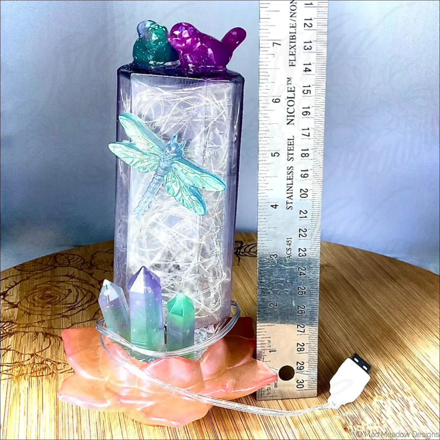 A translucent purple antique amethyst glass apothecary bottle usb light with dragonfly and crystal accents