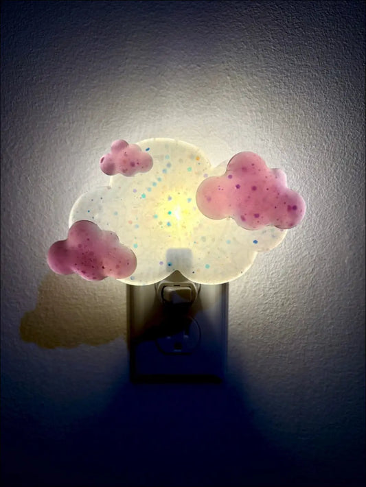 Magenta clouds wall night light glowing with pink white resin clouds and blue dots on plug-in base by mad meadow designs