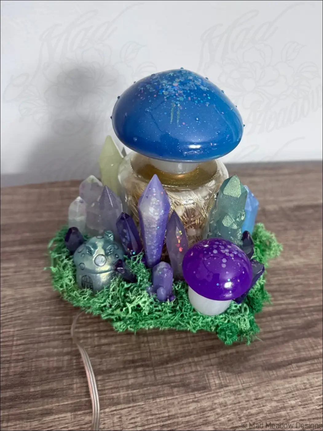 Magical forest mushroom village usb light with whimsical blue and purple resin mushroom and green mossy base accents