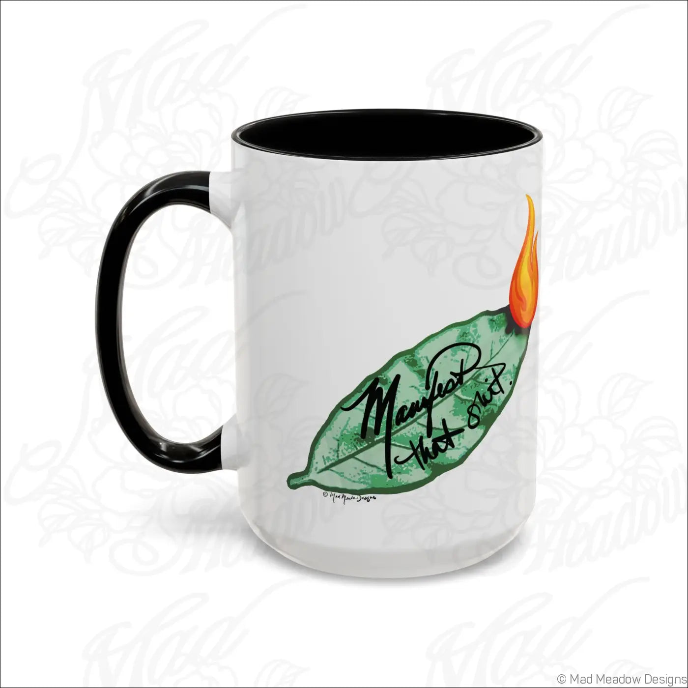 White ceramic mug with black handle and colored interior featuring a bay leaf design and manifest that stuff phrase in cursive with glossy finish