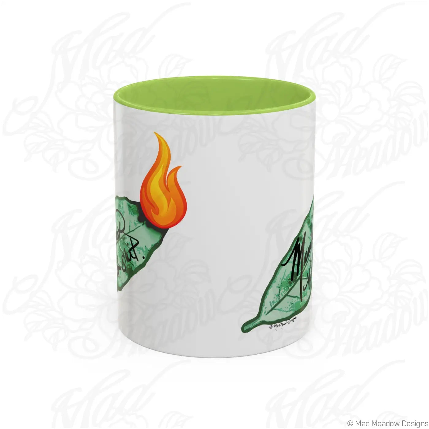 White ceramic mug with glossy finish lime green colored interior and bay leaf design with orange flames accent coffee mug