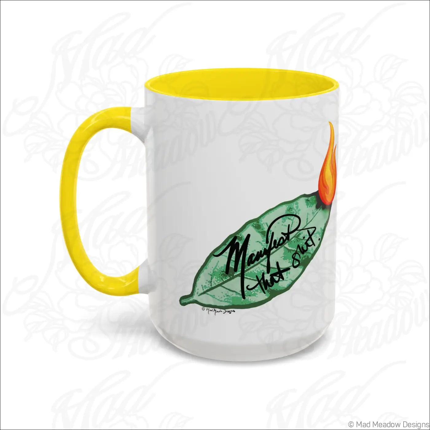 White ceramic coffee mug with glossy finish yellow handle and interior featuring bay leaf design and manifest that stuff text